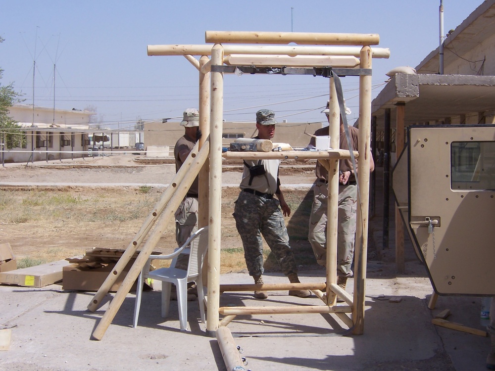 Civil Affairs Soldiers assemble a playground set