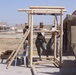 Civil Affairs Soldiers assemble a playground set