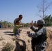 A Soldier &quot;high-fives&quot; a young boy