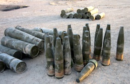 Artillery shells are stacked at a cache site