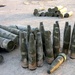 Artillery shells are stacked at a cache site