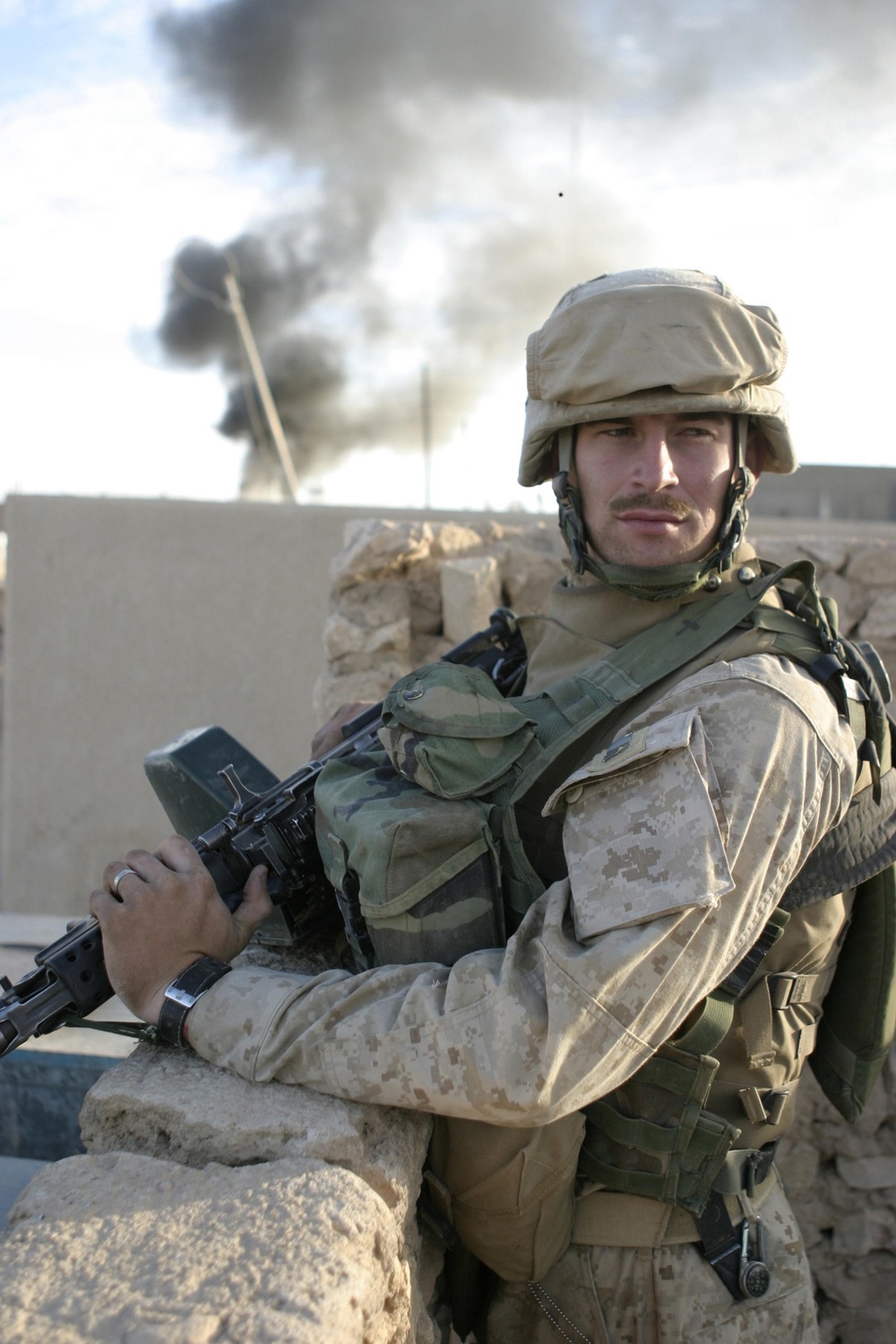 A Marine watches over the streets of Husaybah