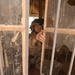 Major David Motes inspects a local schoolhouse