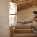 Major David Motes inspects a local schoolhouse