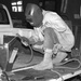 Sgt. Alan D. Mendenhall welds armor on an Iraqi police vehicle