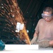 Pvt. Dan L. Trinidad Cuts a Sheet of Metal