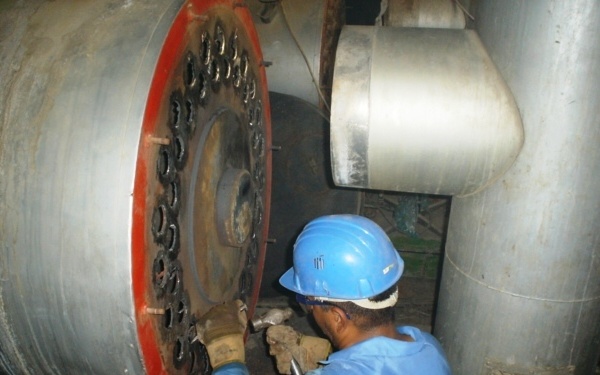 An Iraqi worker overhauls the boilers at Ibn Al Baladi Hospital