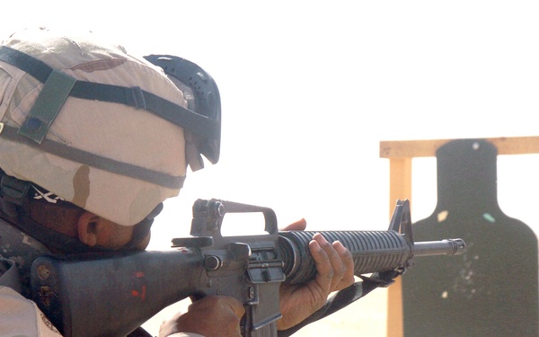 Staff Sgt. Leonard Phillips engages his target