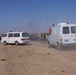 Iraqi ambulances rush to the scene of a car bombing