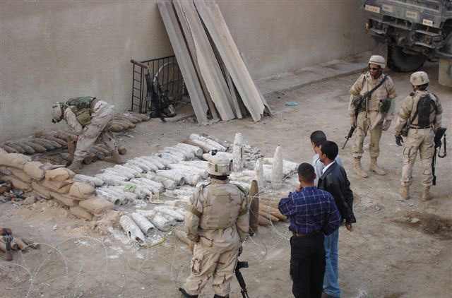Iraqi Firefighters Turn Over Unexploded Ordnance