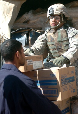 Sgt Richard Cochea unloads medical supplies