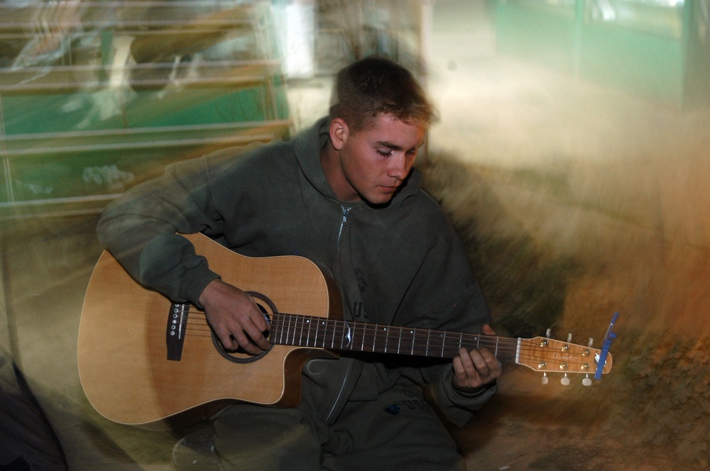 Lance Cpl. Jeremiah K. Barr sings and plays the guitar
