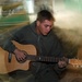 Lance Cpl. Jeremiah K. Barr sings and plays the guitar