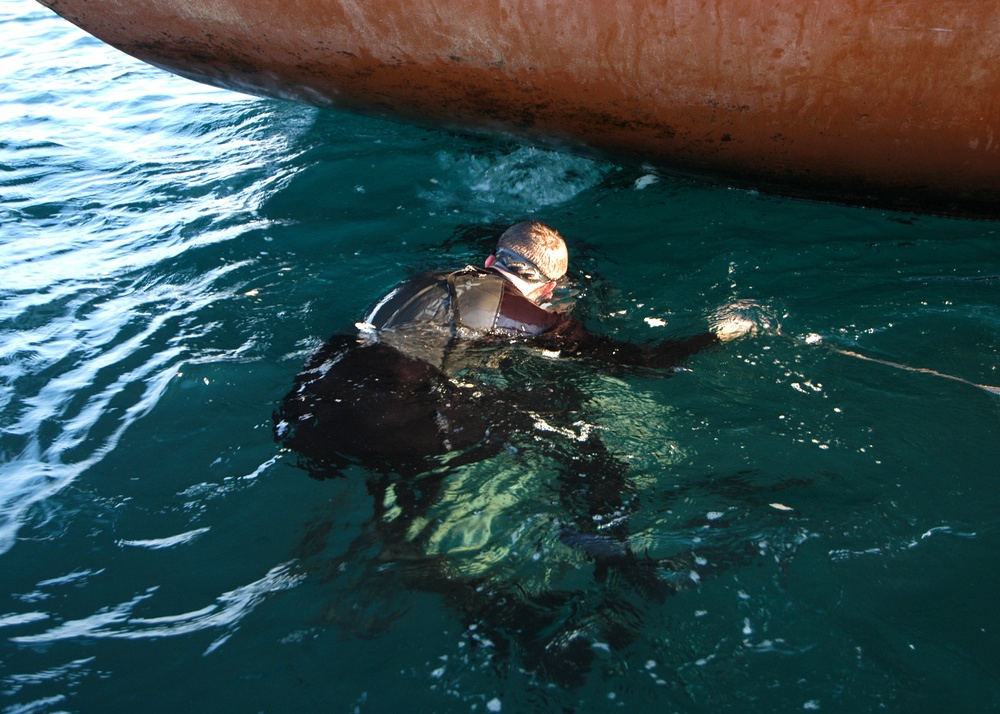 Divers check propeller