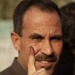 A local Iraqi man shows his inked finger after voting