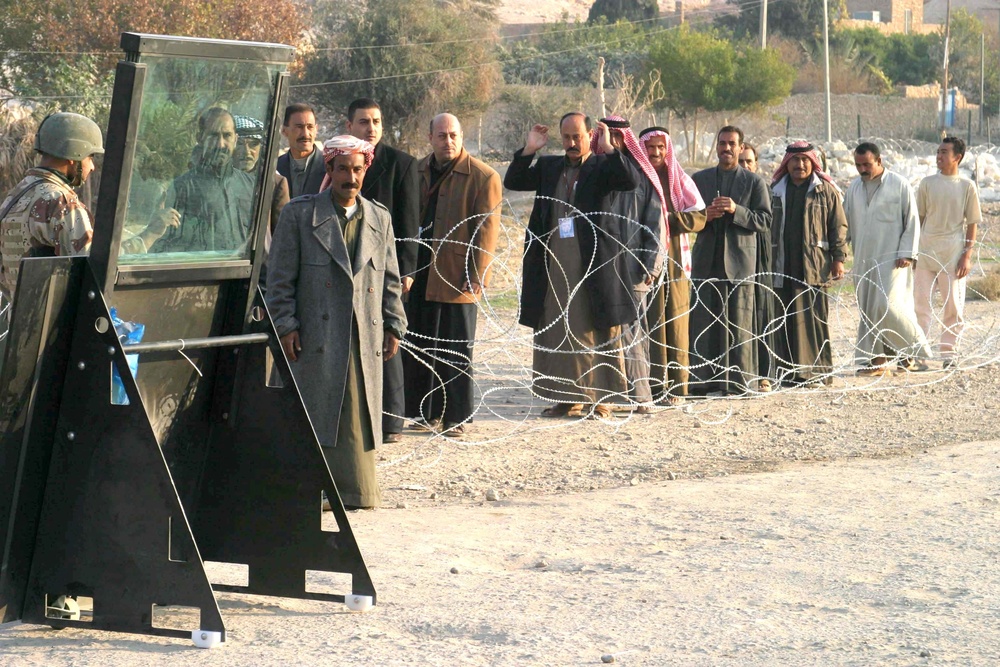 Iraqi voters stand in line