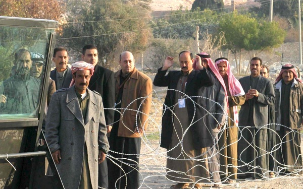 Iraqi voters stand in line