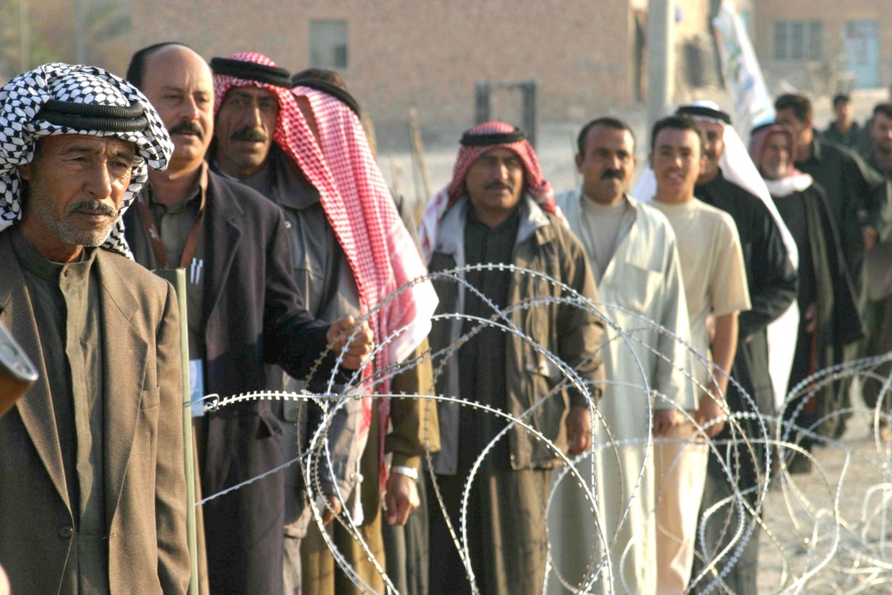 Iraqi voters stand in line