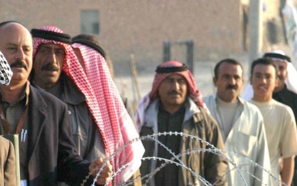Iraqi voters stand in line