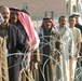 Iraqi voters stand in line