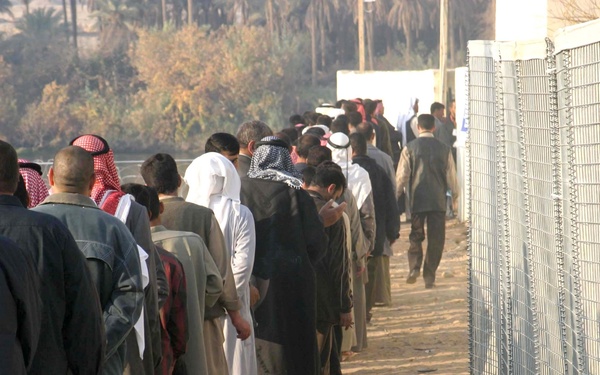 Iraqi voters stand in line