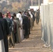 Iraqi voters stand in line