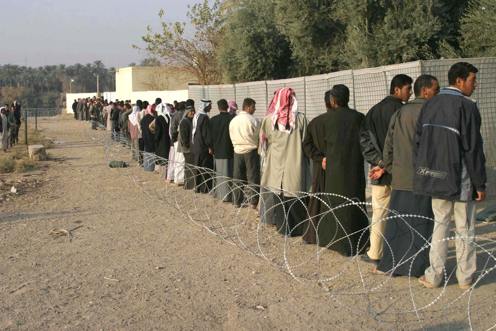 Iraqi voters stand in line