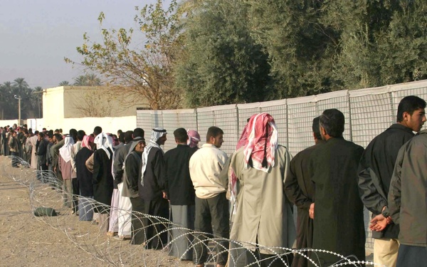 Iraqi voters stand in line