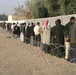 Iraqi voters stand in line