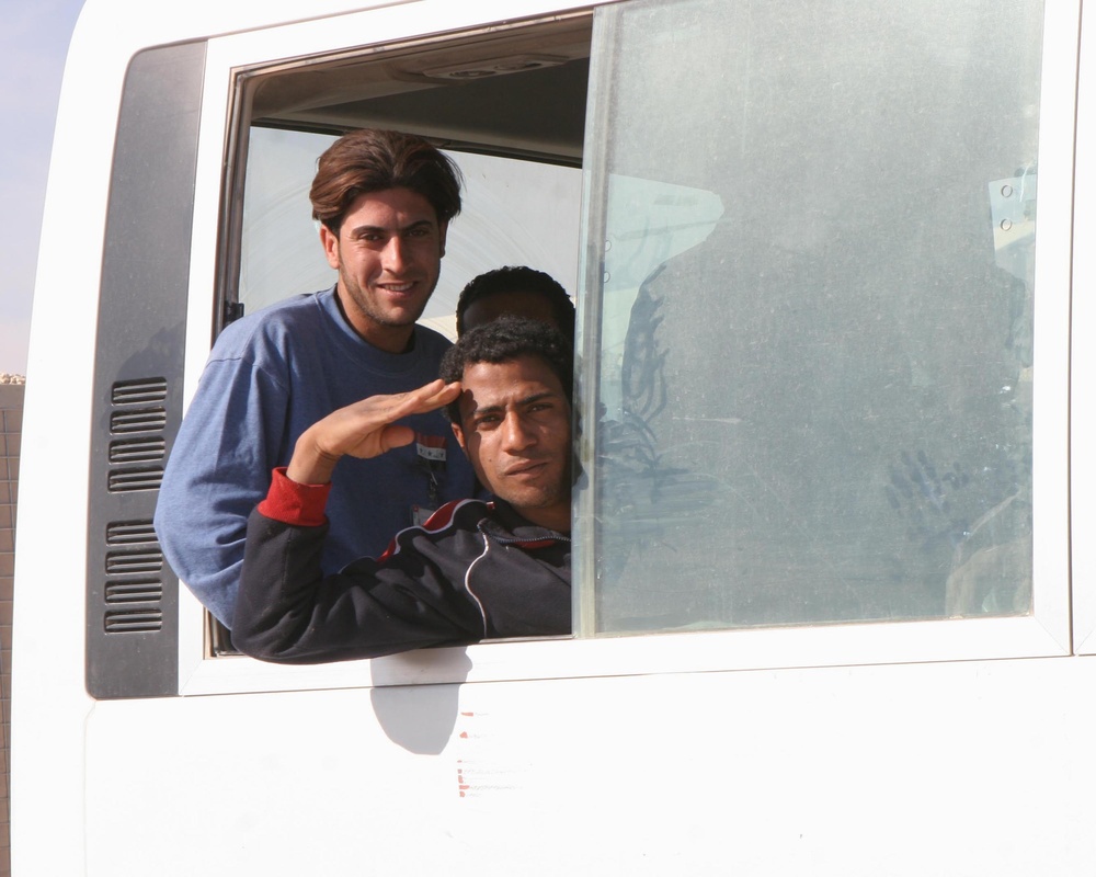 Poll Workers Ride in a Bus