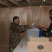Colonel Rizak Saleem drops a ballot in the ballot box