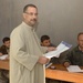 An Iraq citizen takes a ballot