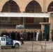 Citizens of Fallujah stand at a polling site