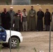 Citizens of Fallujah stand at a polling site