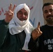 Two local men proudly display their purple fingers