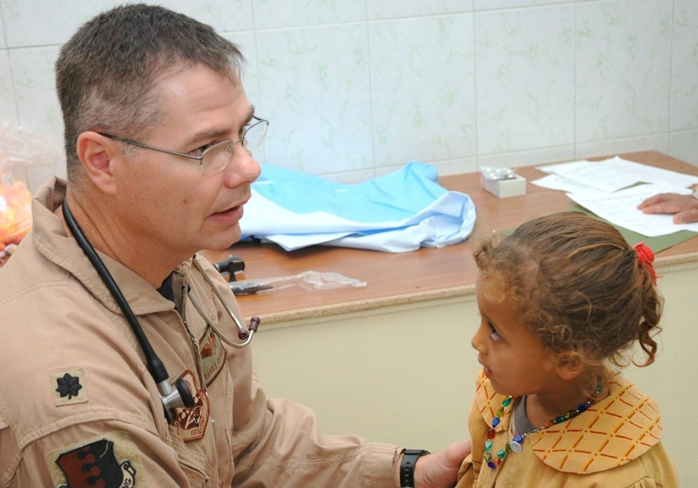 Dr. Guliuzza discusses the findings of his exam to the patient's mother