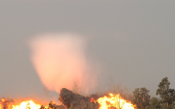 A fireball and shockwave cone shoot into the sky