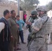 Lt Col. Kevin Brown talks with Iraqi citizens