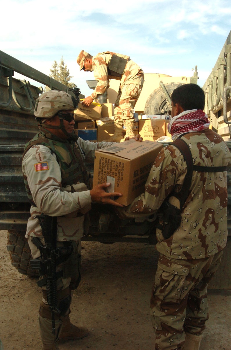 Iraqi Army Soldiers deliver supplies, smiles to school