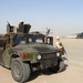 A patrolman guards two MH-53 Pave Low helicopters on Christmas Eve