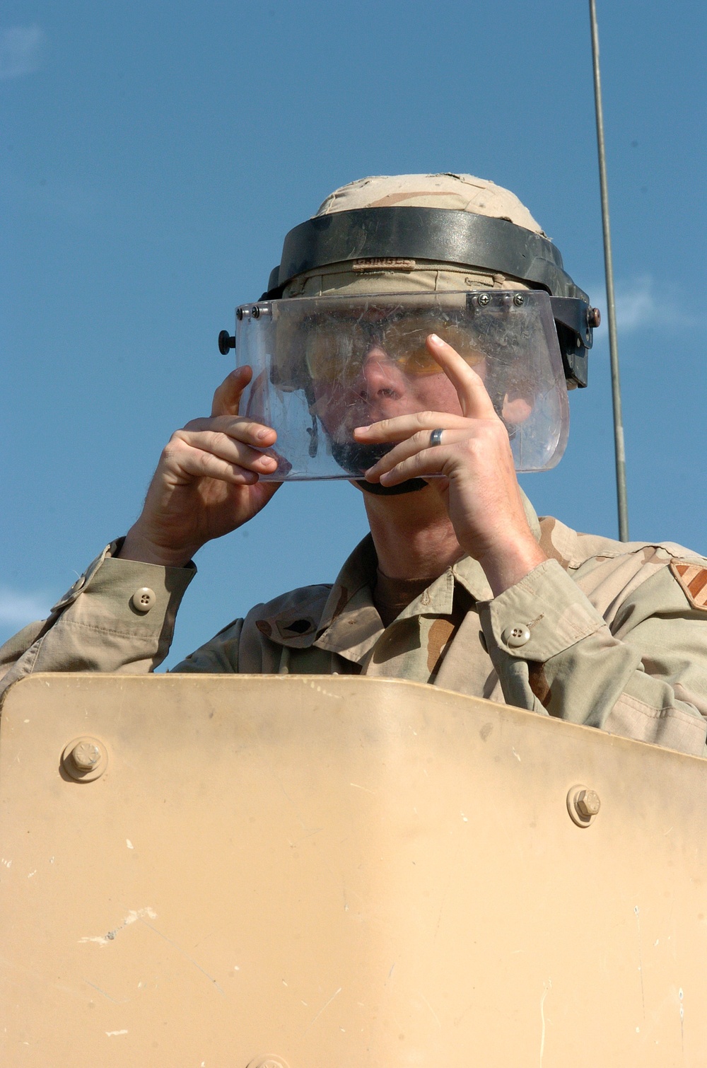 Spc. Jeremy Cringle wears the Kevlar-mounted face shield
