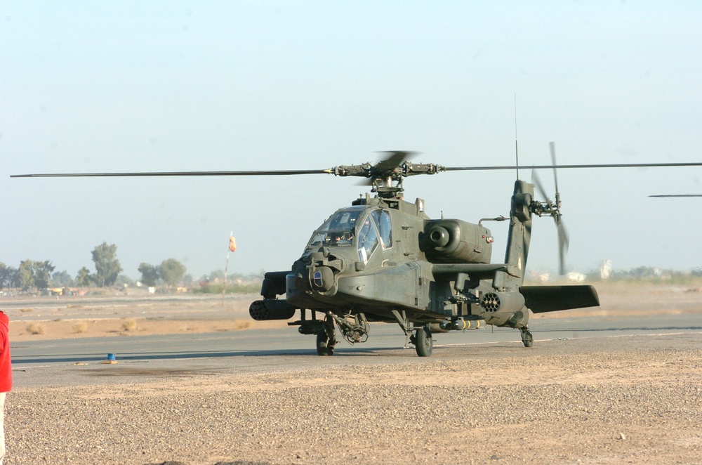 An AH-64 Apache taxis down the runway