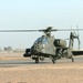 An AH-64 Apache taxis down the runway