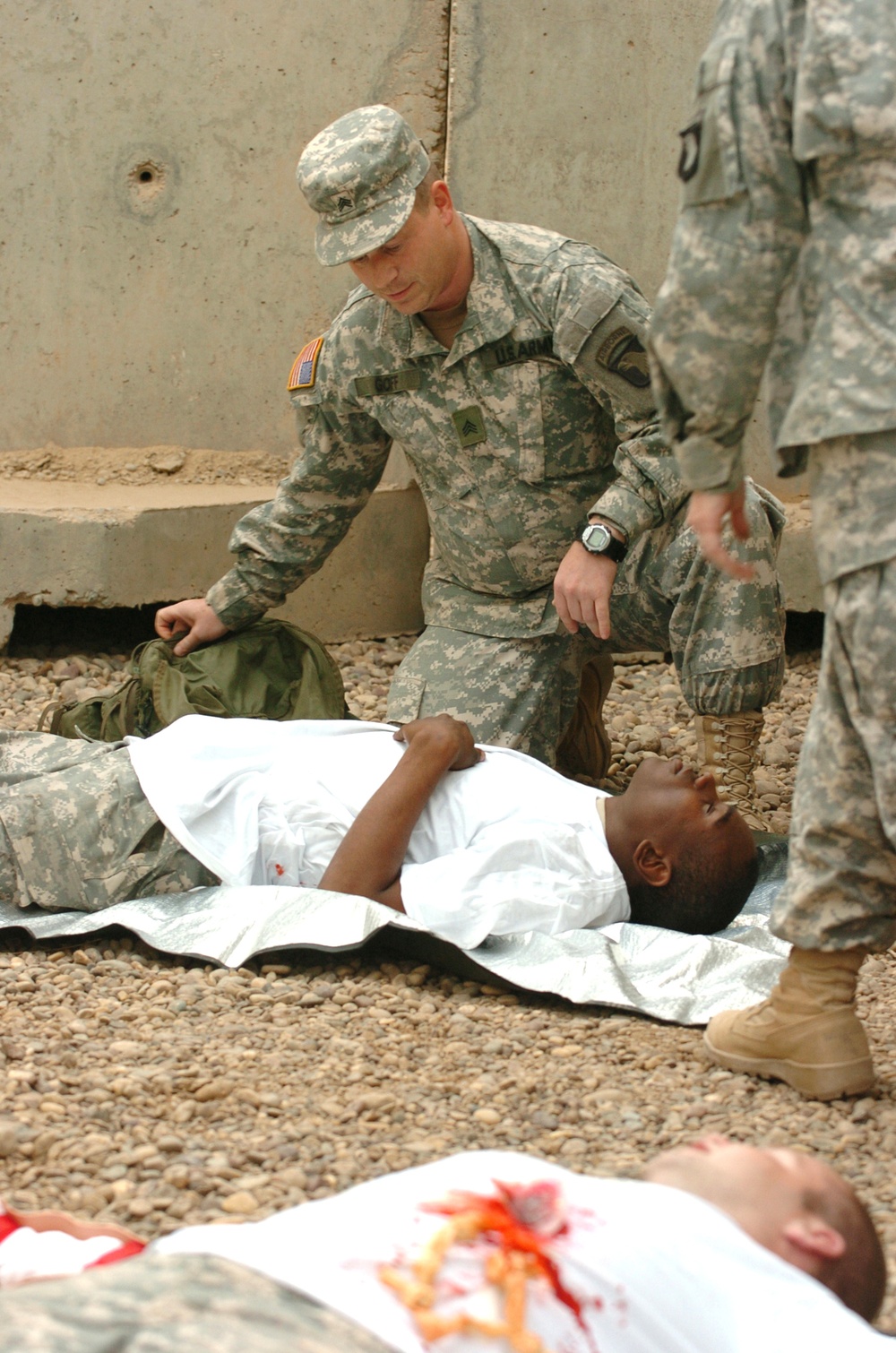 Sgt. Goff Assesses a Simulted Casualty