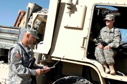 Spc. McGuire goes over a pre-mission check list with Staff Sgt. Roberts