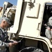 Spc. McGuire goes over a pre-mission check list with Staff Sgt. Roberts