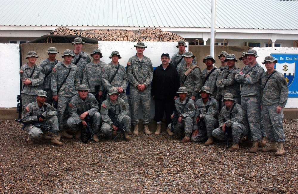 Bernard Planche Poses With Soldiers