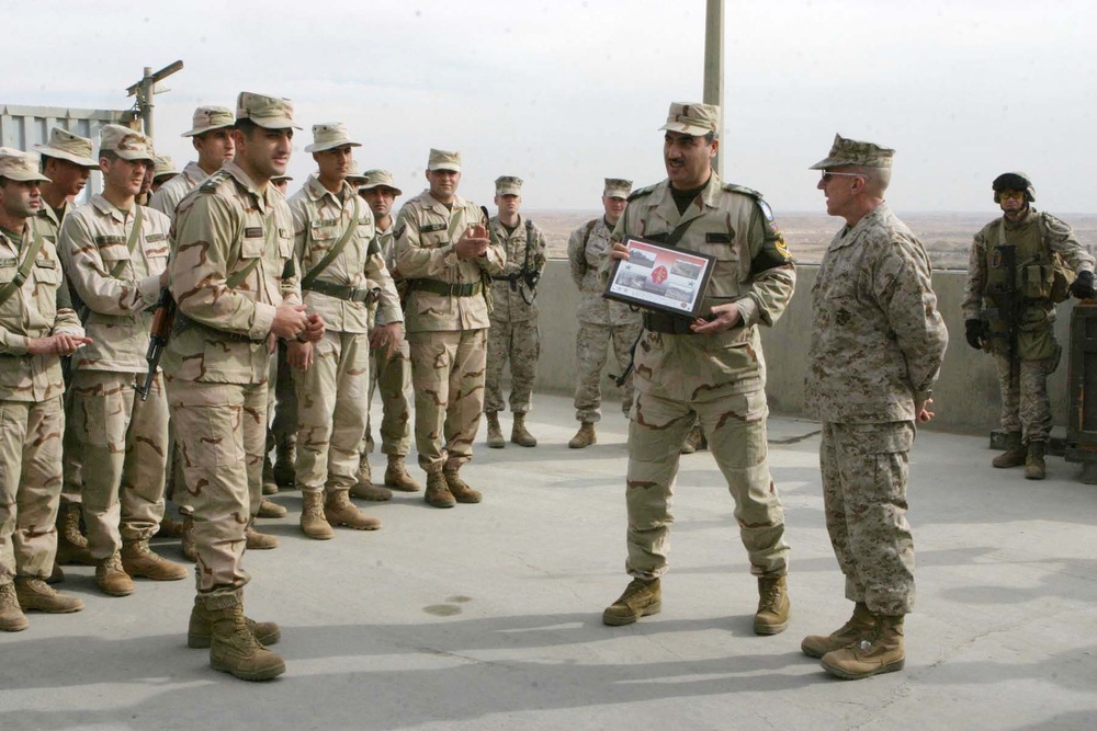 CG visits coalition troops, presents award