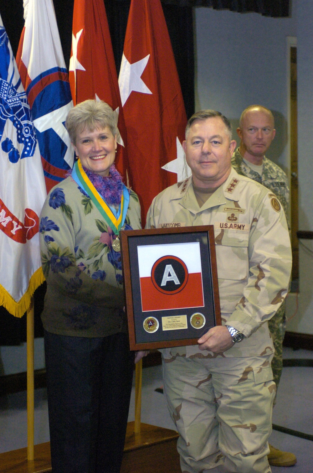 Cathy Speer receives the U.S. Central Command Commander's Outstanding Com