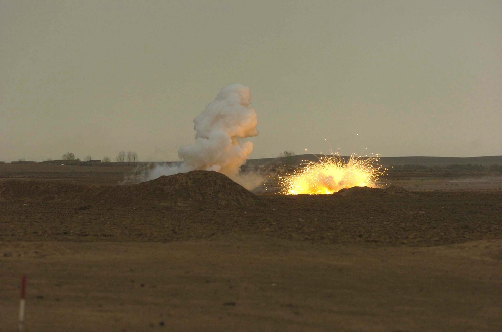 An 81mm white phosphorus mortar round bursts on impact